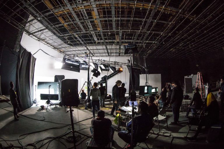 band playing on stage during daytime video production, filmmaker, online portfolio
