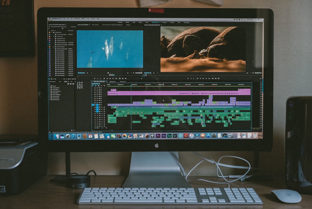 black iMac, Apple Magic Keyboard, and Apple Magic Mouse imovie export screen, video resolution, iphone editing