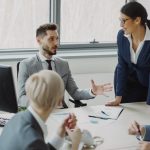 Business professionals collaborating in a modern office meeting. workplace conversation, professional discussion, calm meeting