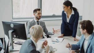 Business professionals collaborating in a modern office meeting. workplace conversation, professional discussion, calm meeting