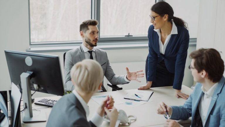 Business professionals collaborating in a modern office meeting. workplace conversation, professional discussion, calm meeting