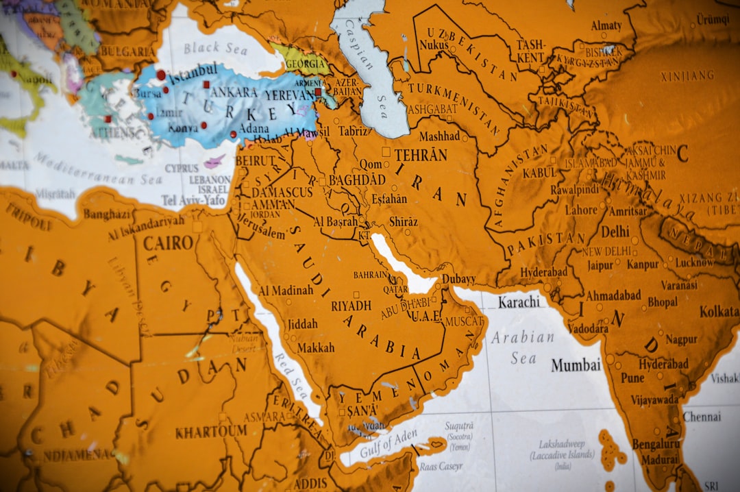 Close-up of a world map showing the middle east. world map, speech bubbles, multilingual text