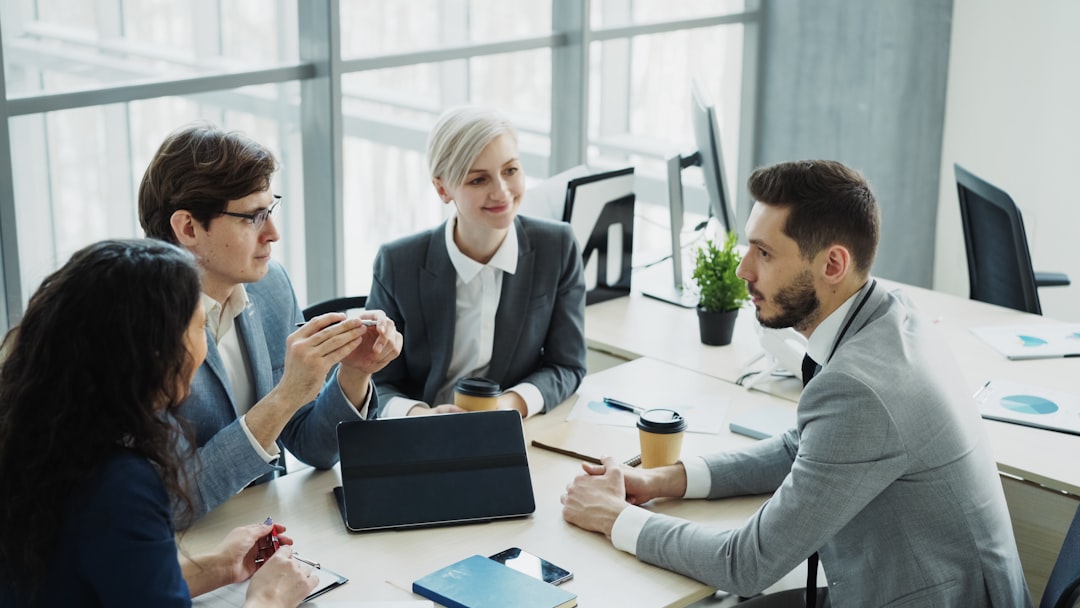Diverse business team collaborating in a modern office. audit meeting, compliance documents, office discussion