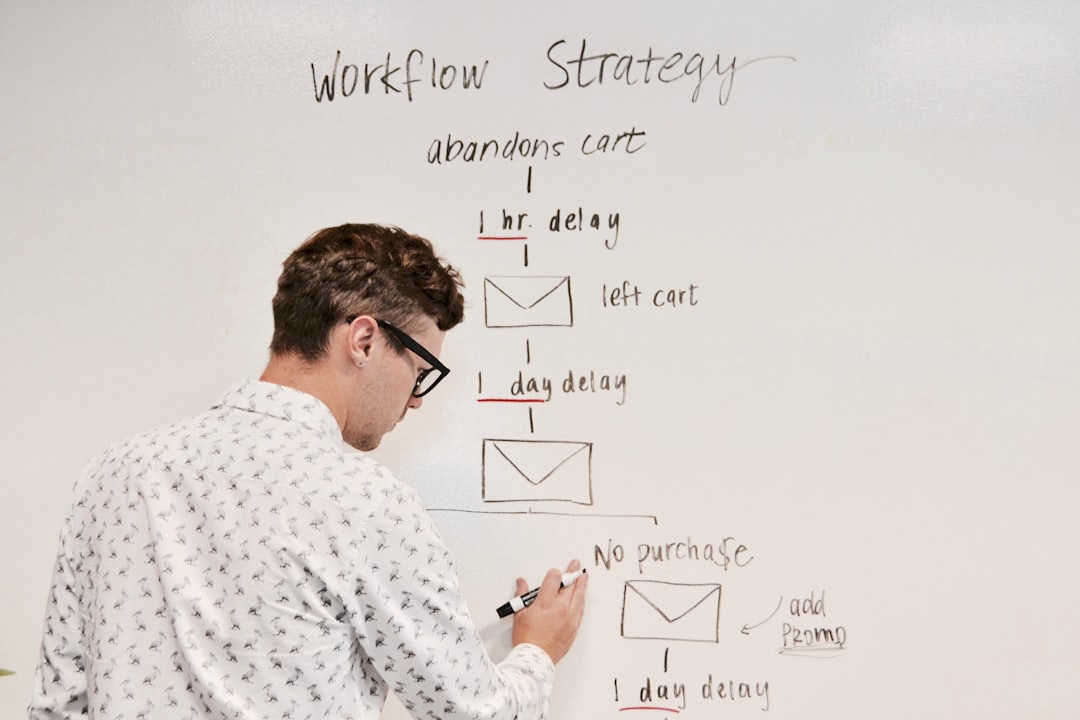 man writing on whiteboard email campaign, buyer journey, sales funnel