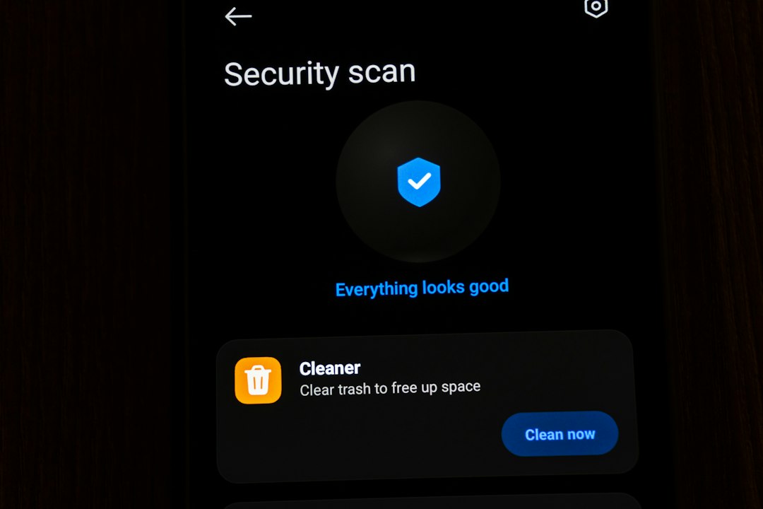 Mobile phone showing a security scan and cleaner interface email security, external contact, warning popup
