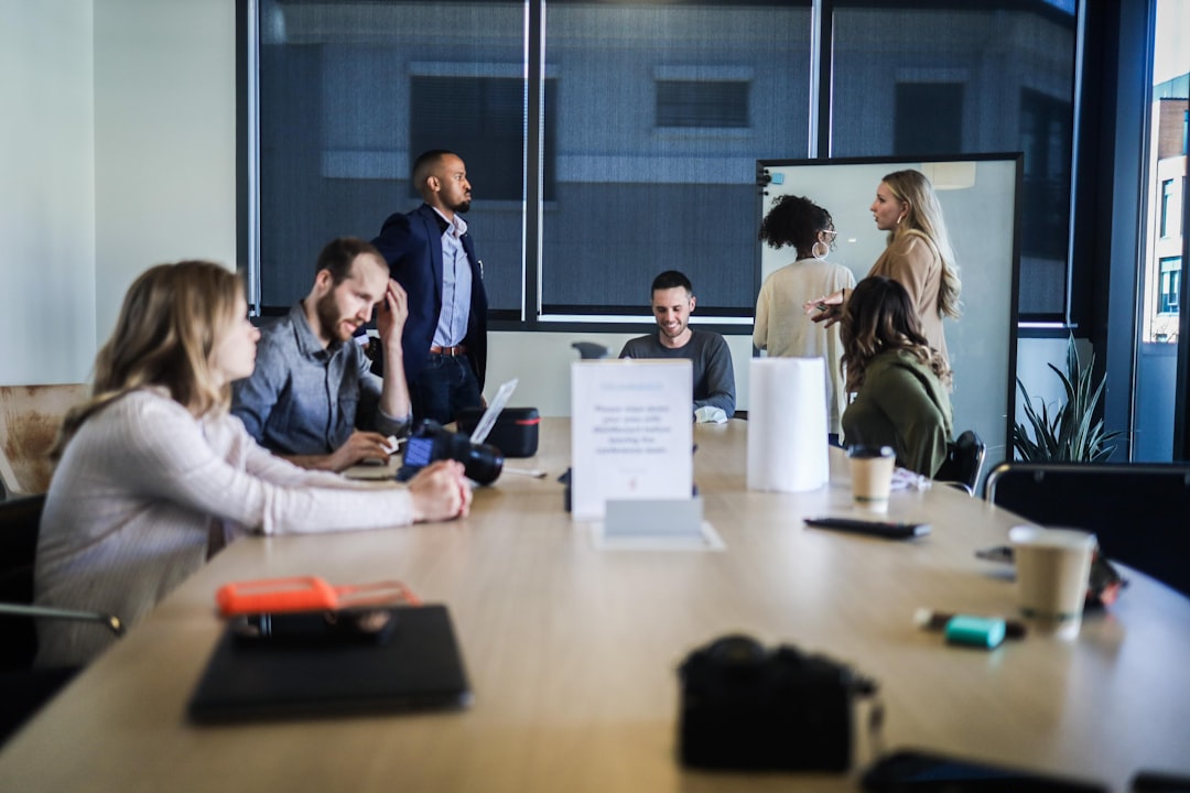 people sitting at the table executive team, office meeting, contact research