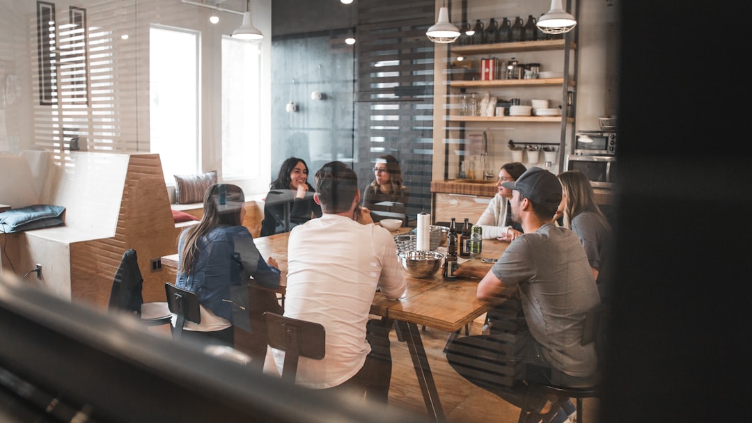people sitting on chair workplace conversation, professional discussion, calm meeting