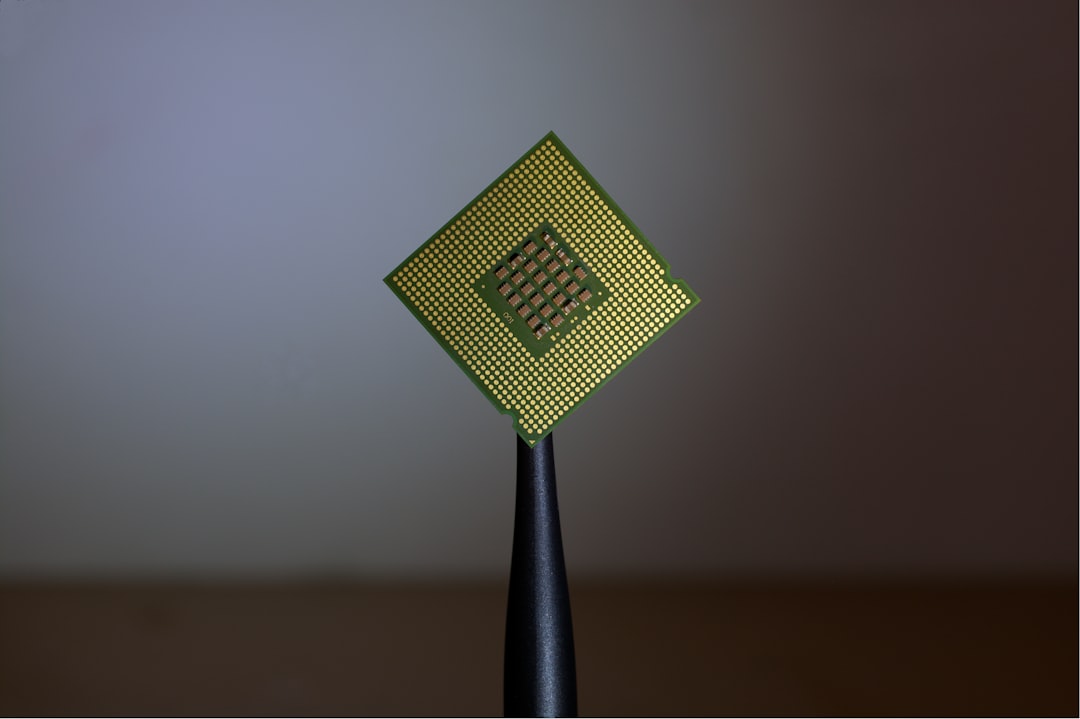 person holding computer cell processor flash memory chip, microprocessor, digital electronics