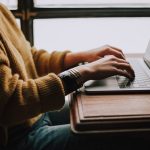 person sitting front of laptop online course laptop learning