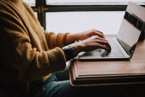 person sitting front of laptop online course laptop learning