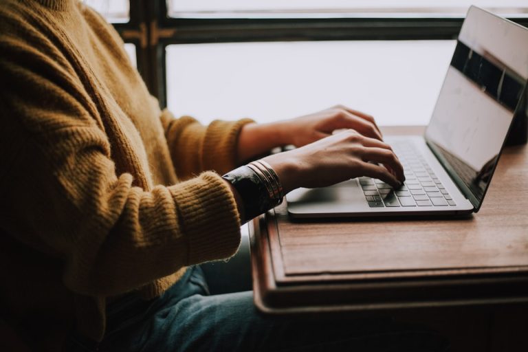 person sitting front of laptop online course laptop learning