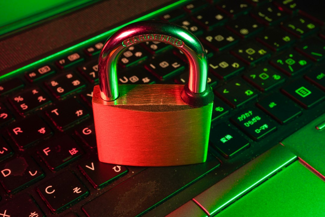 red padlock on black computer keyboard online form, human check, spam protection