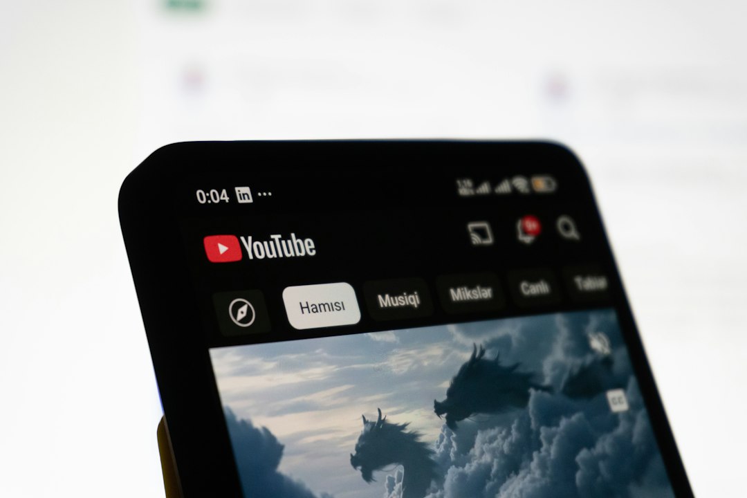 Smartphone displaying the youtube app interface video sharing apps, cloud upload, compressed video