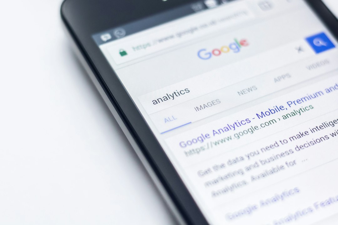 smartphone showing Google site ai search results, marketing analytics, website traffic