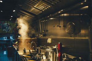 stainless steel cooking pots on stove kitchen display, restaurant orders, chefs, indian food