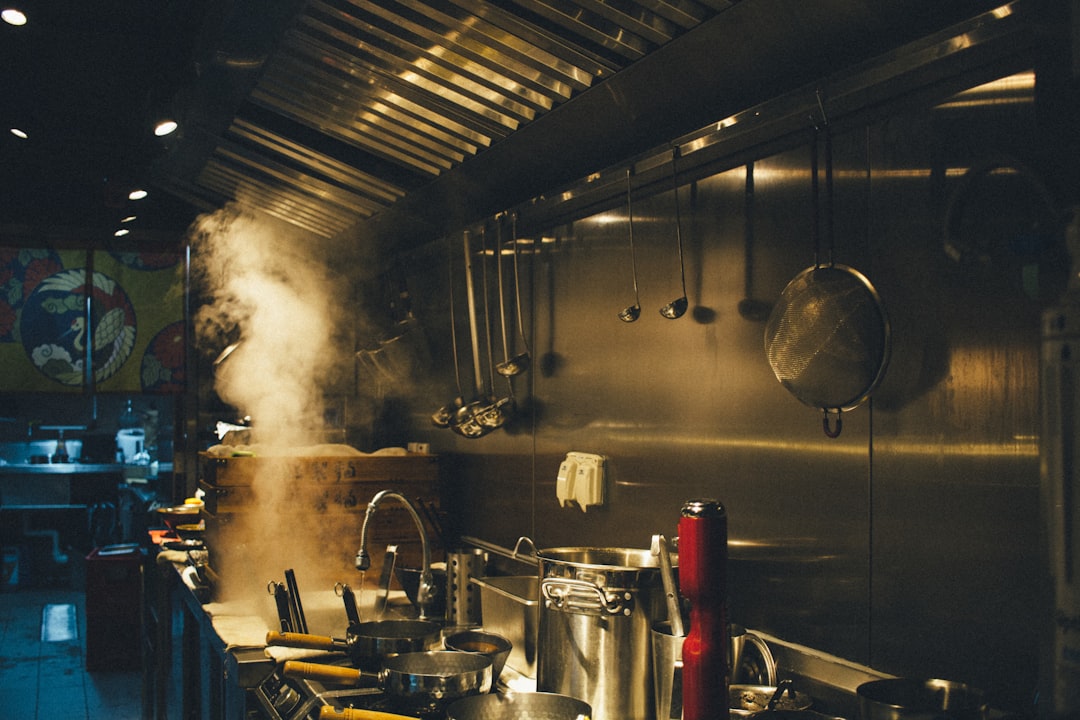 stainless steel cooking pots on stove kitchen display, restaurant orders, chefs, indian food