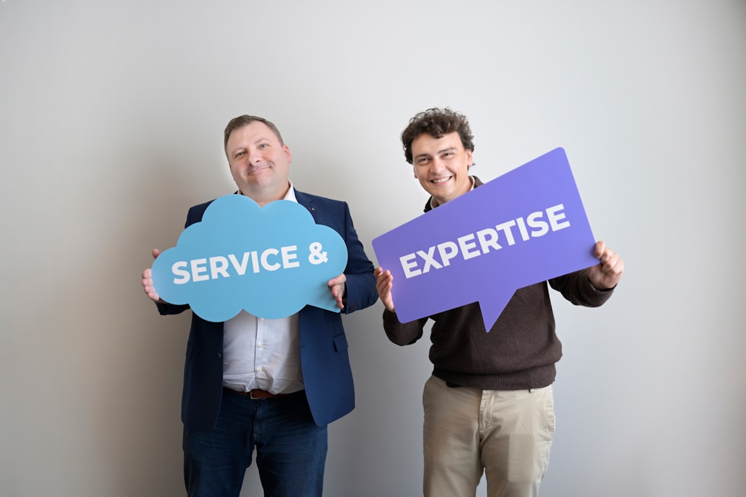 Two smiling men holding "service &" and "expertise" signs. happy customer, local business, friendly service