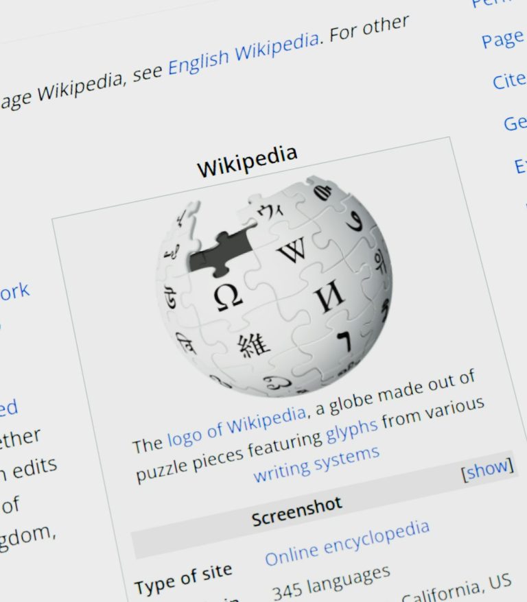 Wikipedia logo globe with text on screen website migration, search rankings, redirect map