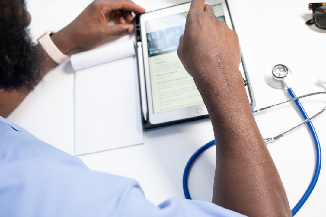 a man using a tablet healthcare staff training, workflow planning, finance operations