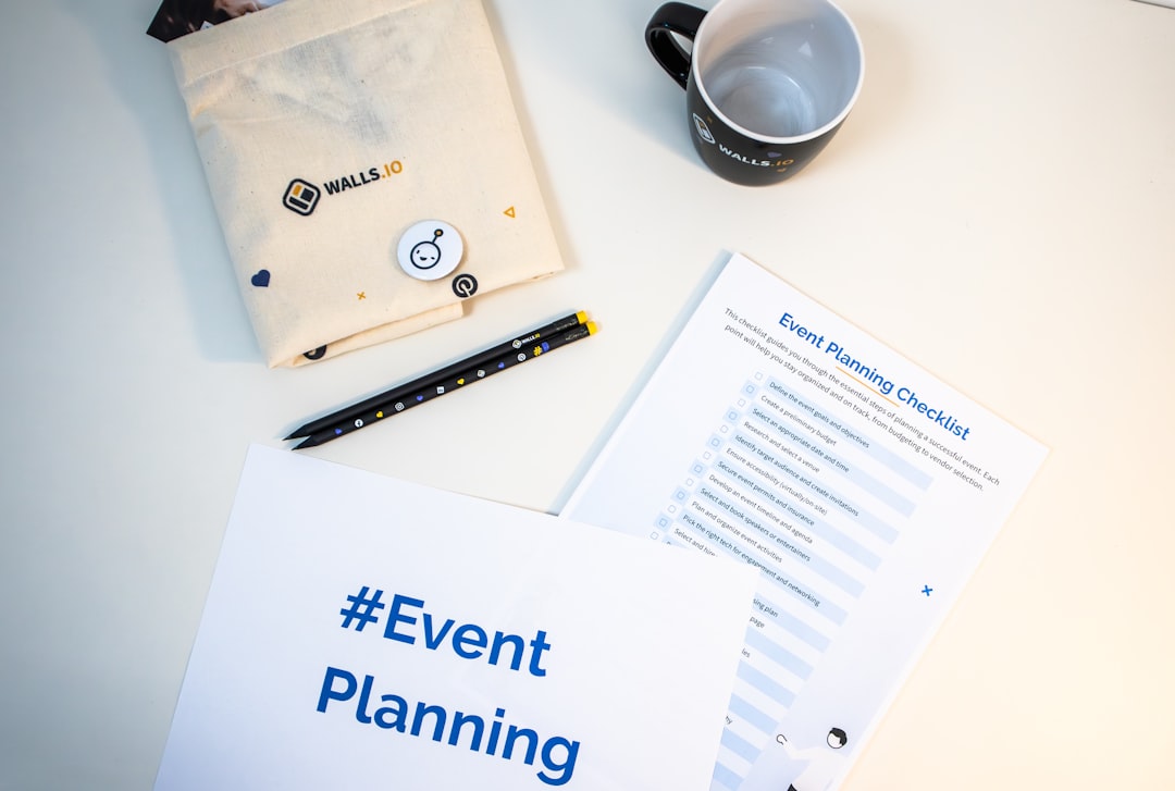 a table with a coffee cup, notepad, pen, and envelope event schedule, digital rundown, production planning