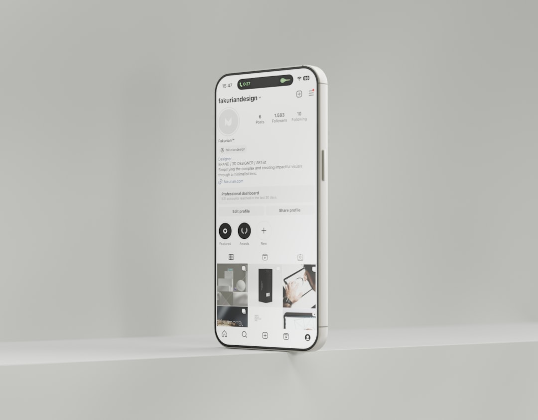 a white cell phone is hanging on a wall email editor, gif upload, mobile preview