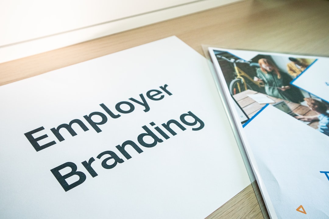 an employee branding brochure on a table payroll software, employee benefits, small business hr