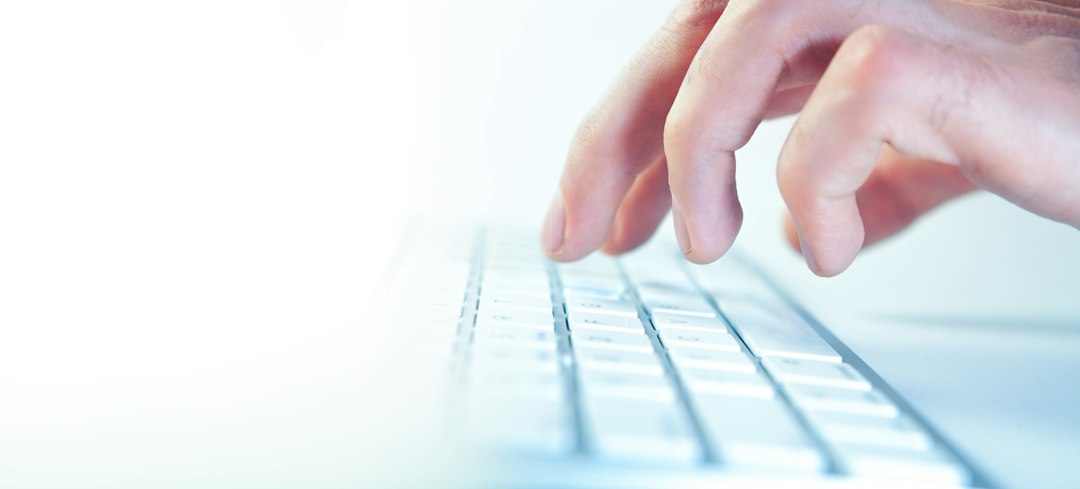 Fingers typing on a computer keyboard cloud security, legal data, remote work, secure access