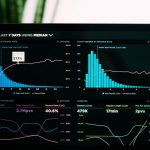 graphs of performance analytics on a laptop screen fundraising software, comparison chart, nonprofit technology