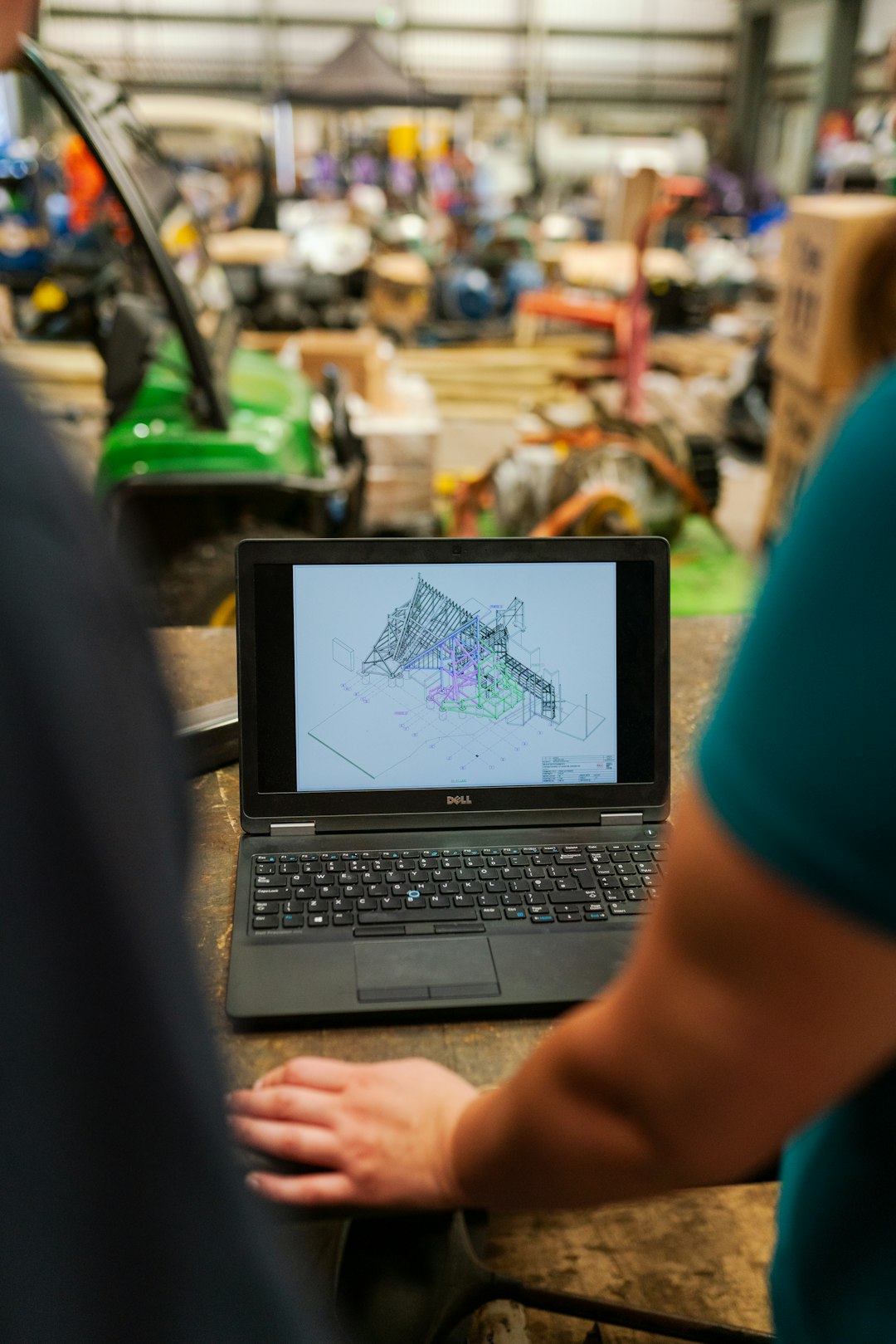 person in blue shirt using black laptop computer product lifecycle, engineering team, digital workflow, connected data