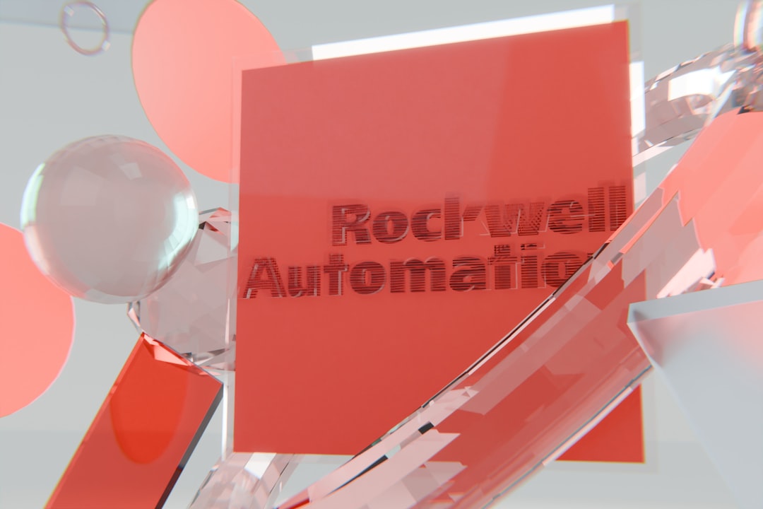 Rockwell automation logo on a red block with abstract shapes. invoice automation, finance team, document processing