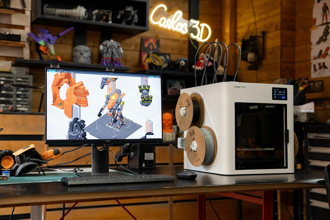 3D printer with computer displaying design on desk cad comparison, drafting software, design tools