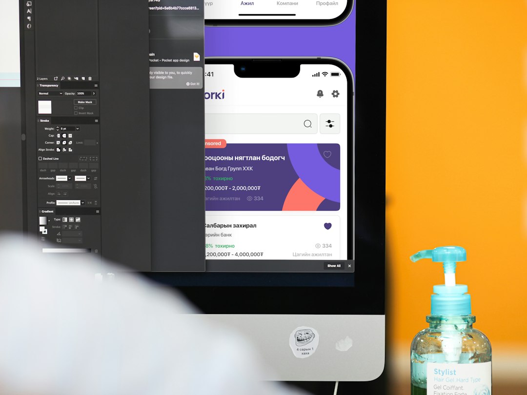 a bottle of hand sanitizer next to a computer screen ai image comparison, product mockup, readable text