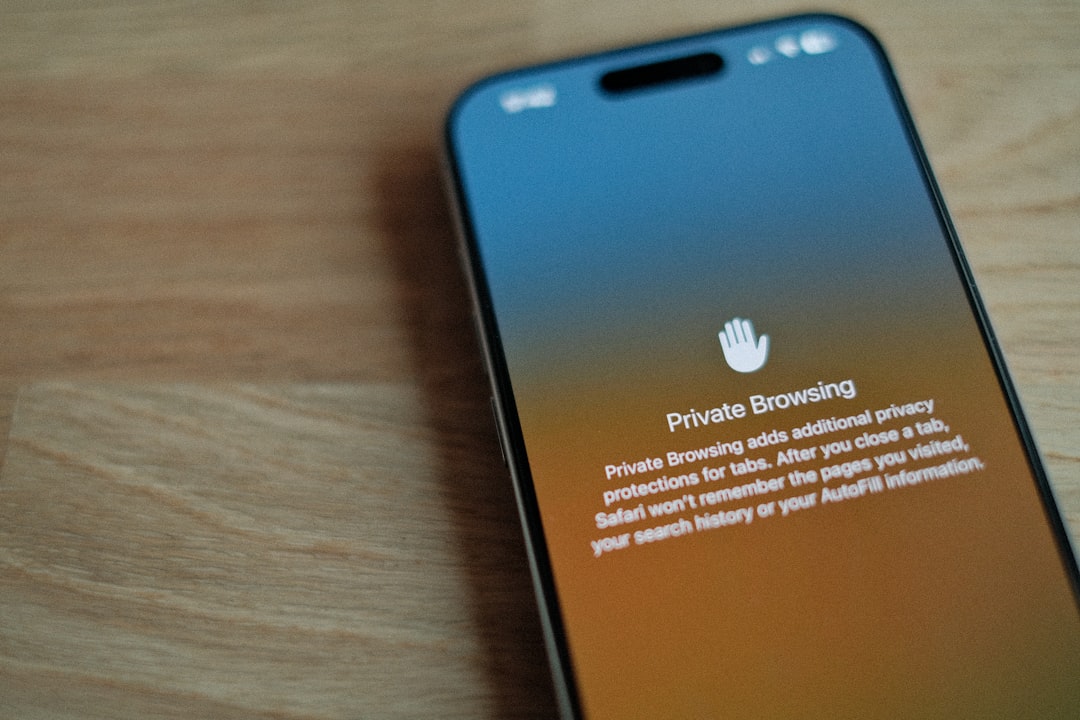 A cell phone sitting on top of a wooden table app permissions, sync settings, security review
