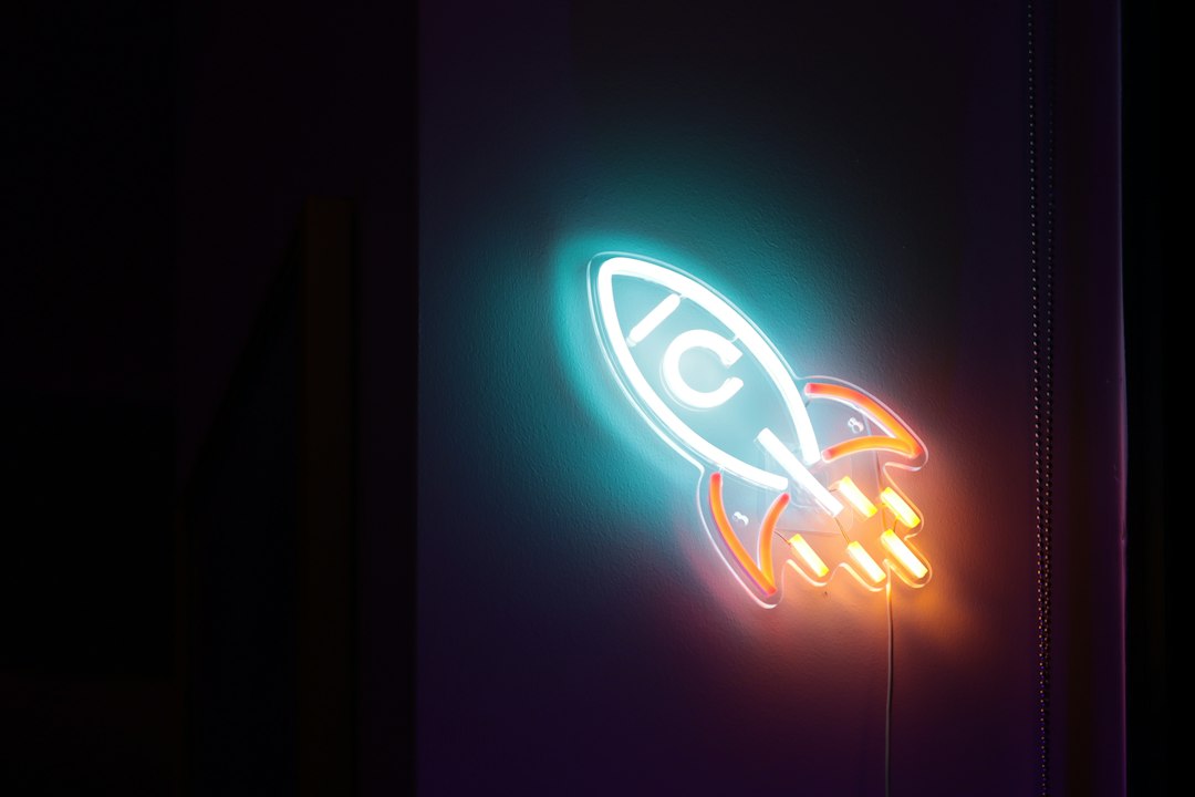 a neon sign with a rocket ship on it fast website, rocket, clock, loading page