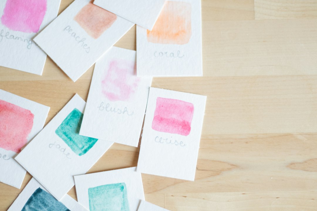 a wooden table topped with lots of different colored cards visual schedule, calming colors, routine cards