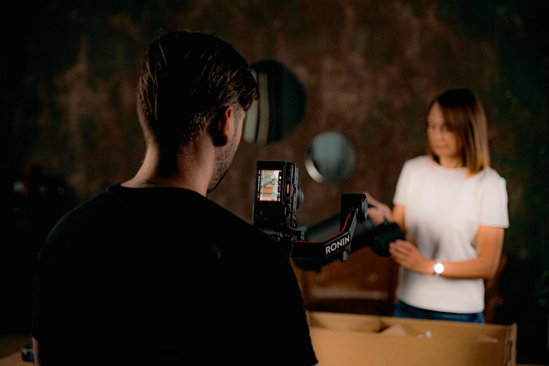 Filming a woman with a camera and gimbal rig iphone filming action, bright light, steady shot