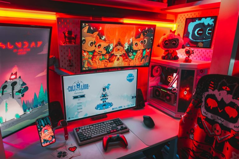 Gamer's setup with multiple monitors and rgb lighting stock chart, video game launch, investor desk