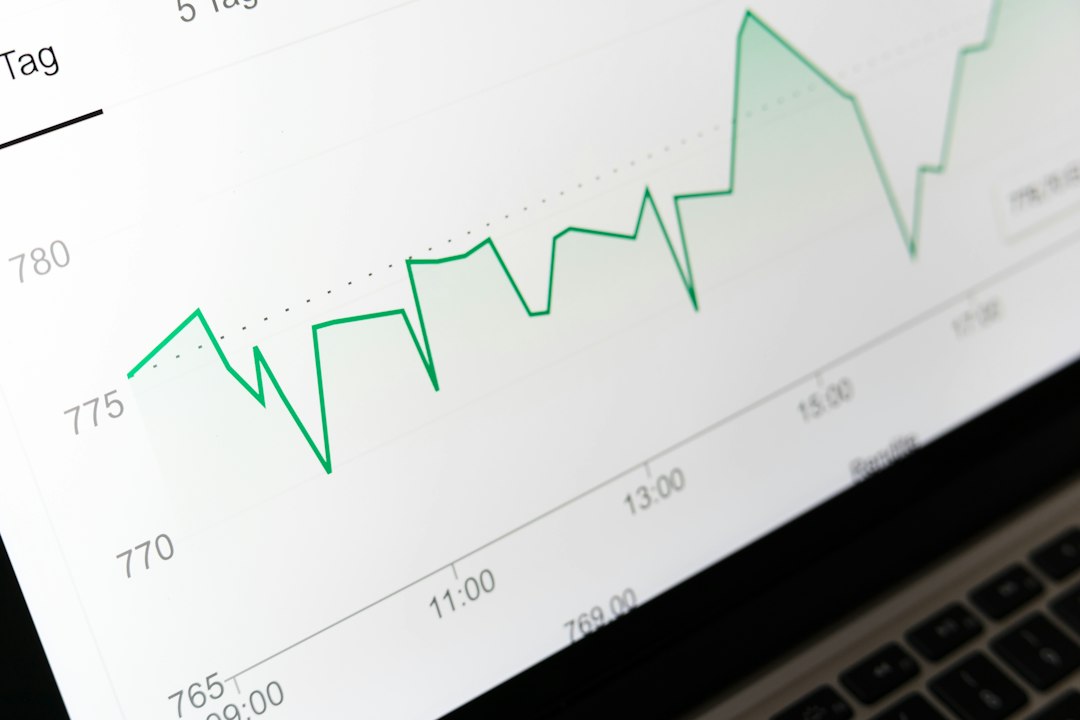 stock market chart displayed on laptop screen pitch deck analytics, slide views, investor interest