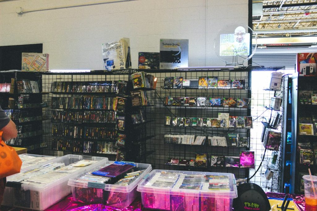 Store interior with shelves of merchandise and items on tables console storefront, game preorder, digital download