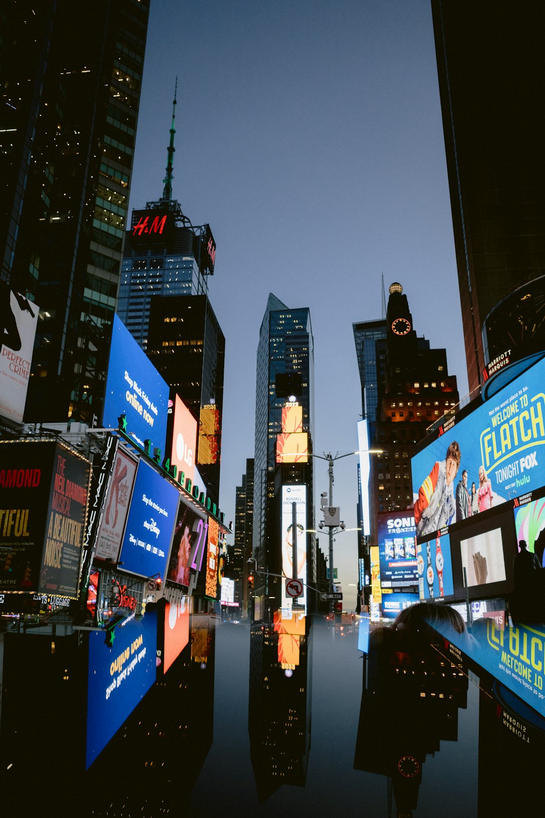 a city street with many billboards corporate crisis newsroom, public relations team, media monitoring
