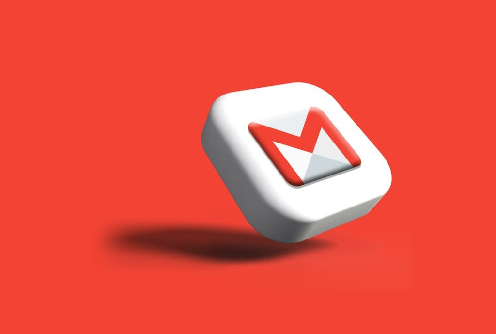 a close up of a white and red object on a red background newsletter cta button, email design, click analytics