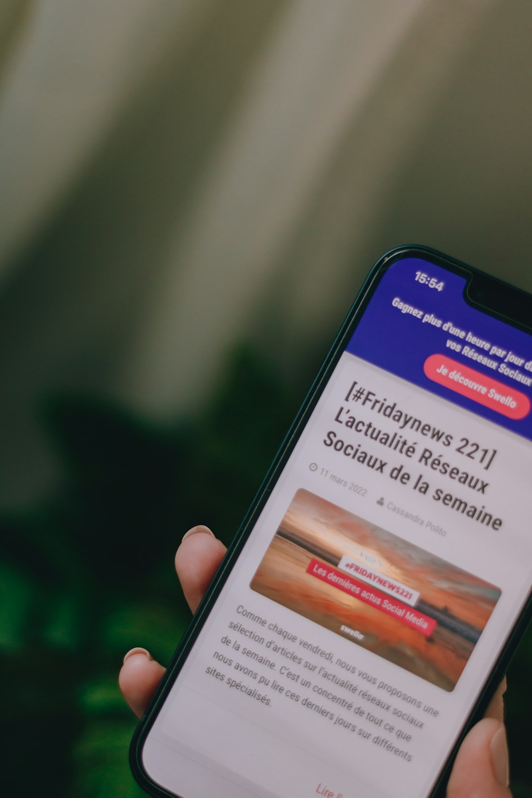 a person holding a cell phone in their hand newsletter width, email layout, mobile preview