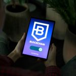 a person holding a tablet with a blockchain logo on it blockchain app wallet smart contract