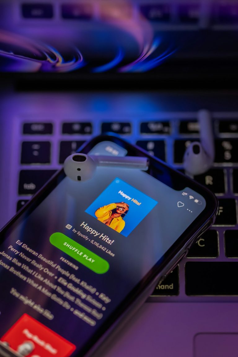 iphone 6 on macbook pro musician laptop spotify upload