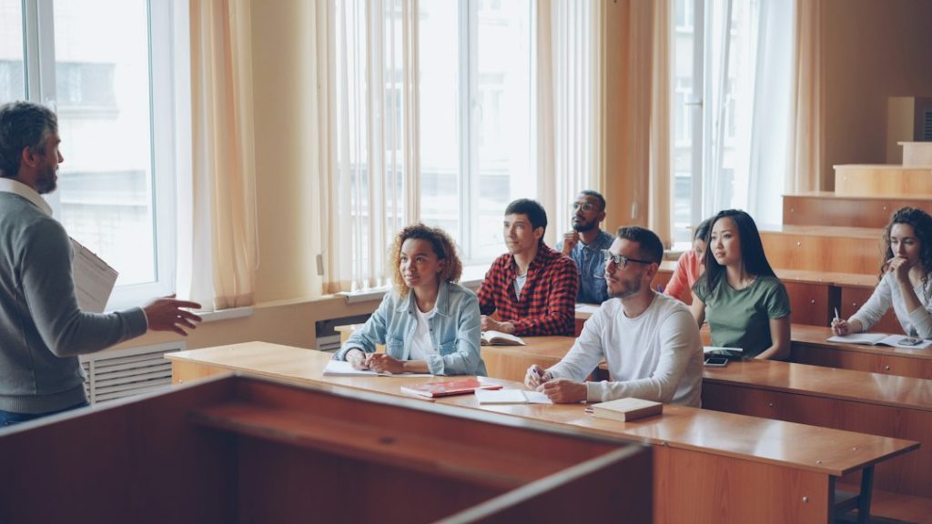 Professor lectures to students in a classroom setting university classroom, exam policy, academic integrity