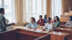 Professor lectures to students in a classroom setting university classroom, exam policy, academic integrity