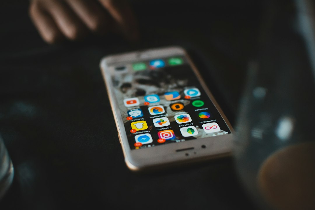 selective focus photography of turned-on gold iPhone 6s music apps comparison, streaming services, desktop icons